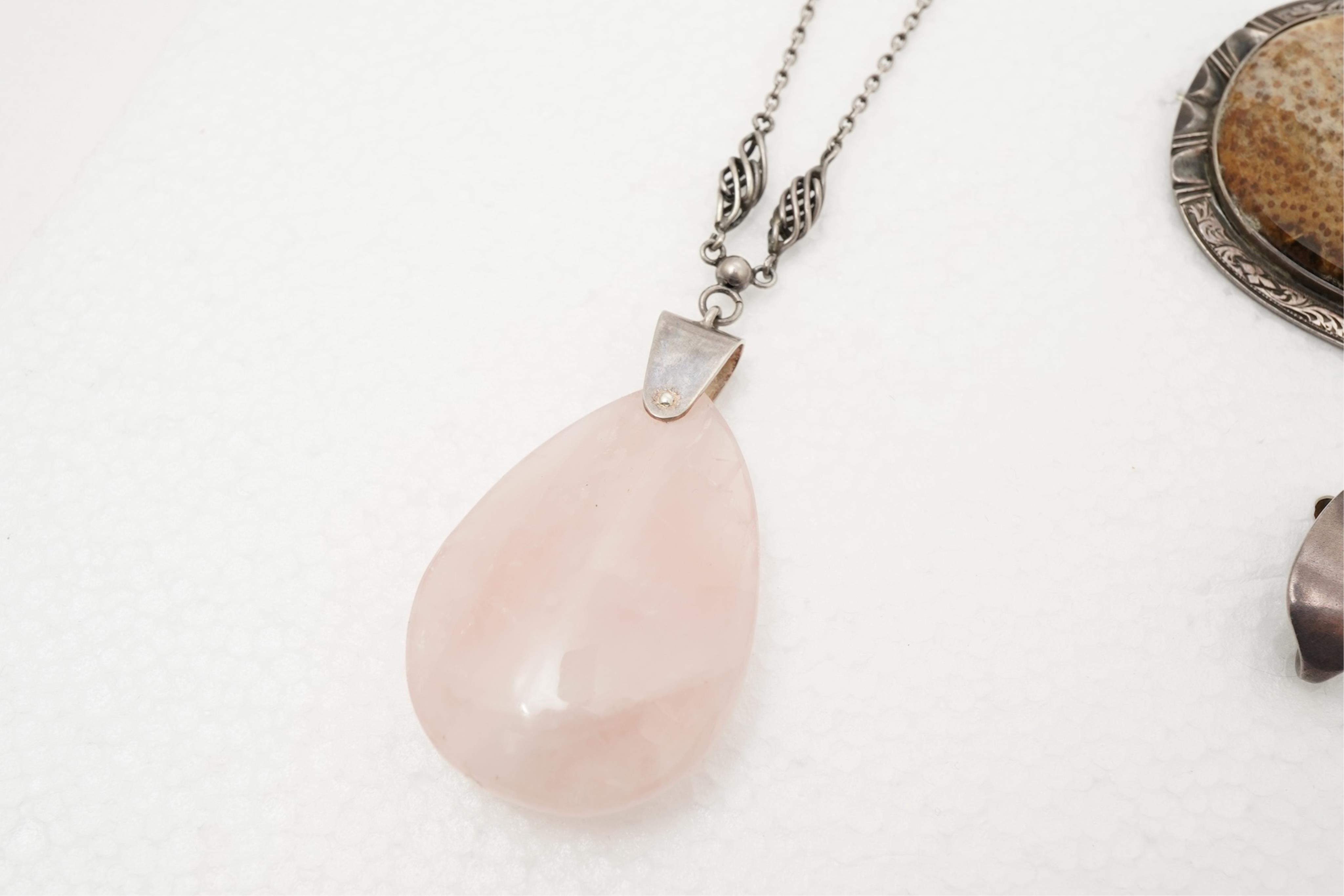 A collection of Arts & Crafts jewels including a pair of silver earrings by Georg Jensen